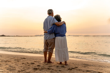 Happy family beach vacations.Group of multi generation family little girl with parents and grandparents relax and enjoy together on the beach.