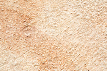 The image shows a closeup of a sandy surface with grainy texture