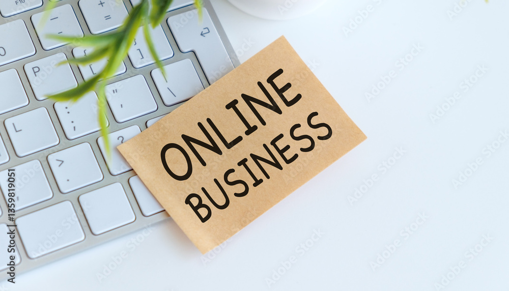 Aufkleber a keyboard with a piece of paper that says online business on it