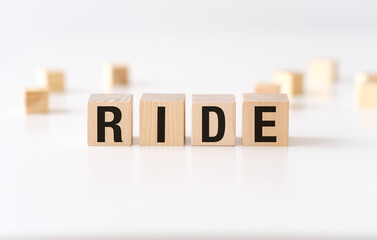 A wooden block with the word Ride written on it