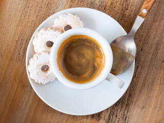 Espresso Coffee Cup with Canestrelli Biscuits and Spoon on Wooden Table