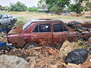 Old car wrecks are left to be washed on a lawn in Bangkok, Thailand, on March 7, 2025.