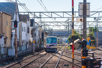 Local train arrive to railway station platform in Kyoto Japan. Train transportation concept.