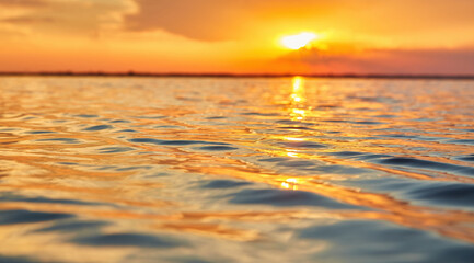 Fototapeta premium Sun Path Reflection on Rippling Water at Sunset
