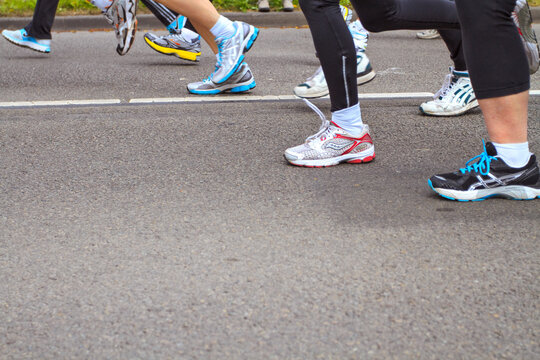 Dordrecht, Netherlands - April 1 2012: The 65th edition &lsquo;Dwars door Dort&rsquo; on Sunday 1 April 2012. Detail of the legs of runners in the 10km race in Dordrecht.