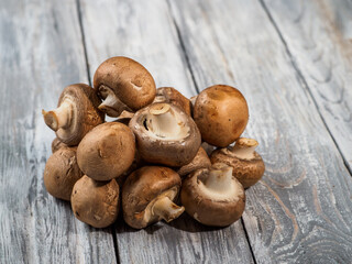 Shiitake mushrooms on wooden background.