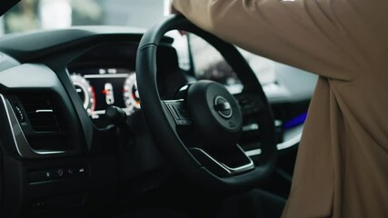  A satisfied, happy woman client sitting behind the wheel of a new car. Concept a joyful moment of car ownership, highlighting the excitement and satisfaction of a new purchase.