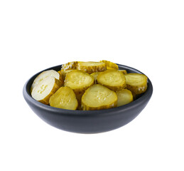 chopped pickled cucumbers in a black bowl isolated on a white background.