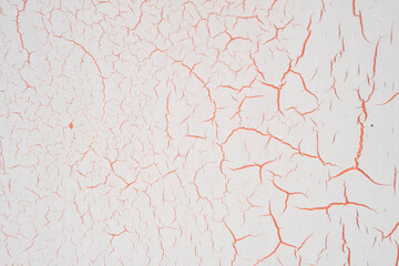 Painted metal surface with cracks due to temperature changes, Background of paint with cracks.