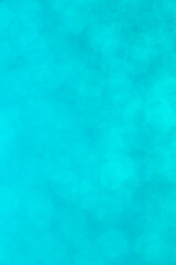 close up of light turquoise bokeh texture