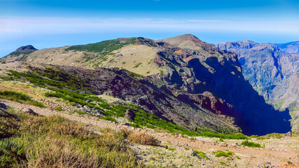 View to Pico do Arieiro, Madeira, majestic peaks , green valleys, sunny sky rugged beauty of island mountains. For travel inspiration, Portugal mountain adventure , copy space.