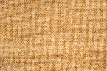 Texture of dense brown fabric for tailoring. Canvas. Textile. Material. Velour