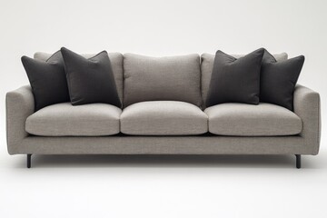 Obraz premium A contemporary sofa featuring decorative cushions and a neutral color palette