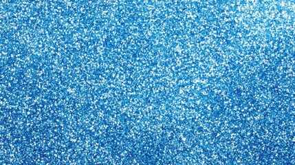 Close-up of sparkling blue glitter texture creating a vibrant background for artistic or creative projects