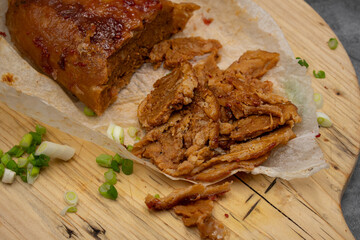 Washed flour seitan cooked with spices,  baked and sliced