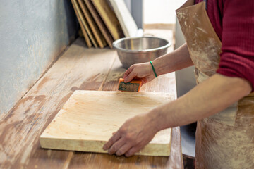 Ceramicist-potter at work. Modeling from clay. Preparing for pottery.