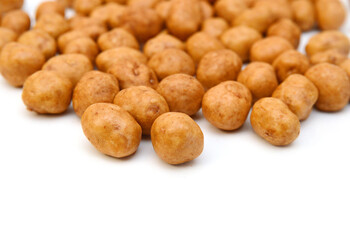 Dried peanuts in closeup on white