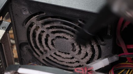Collecting dust from a computer power supply fan grill