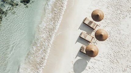 A beach with four umbrellas and a few lounge chairs