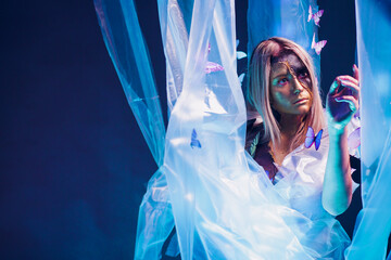 An Artistic Portrait Featuring Beautiful Butterflies and Distinctive, Unique Makeup Designs