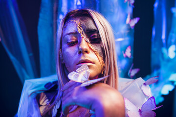 An Artistic Portrait Featuring Beautiful Butterflies and Distinctive, Unique Makeup Designs