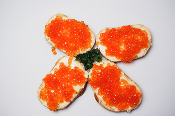 Savor delicious bread with red caviar and fresh parsley, perfect for any occasion