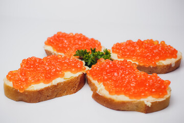 Savor delicious bread with red caviar and fresh parsley, perfect for any occasion