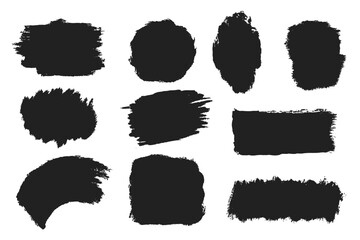 Set of abstract grunge paint shapes in black ink on white background