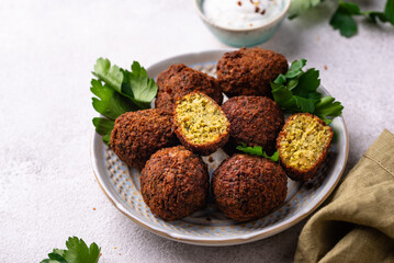 Middle Eastern falafel balls with sauce
