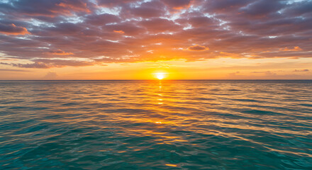 Obraz premium Fiery Sunset over Calm Caribbean Sea, Vivid Orange and Purple Hues