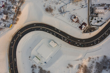 Aerial view of curved road in the city.