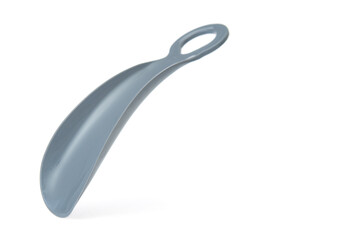 Plastic shoehorn close up isolated on white background