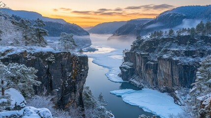Winter sunrise over a frozen river gorge