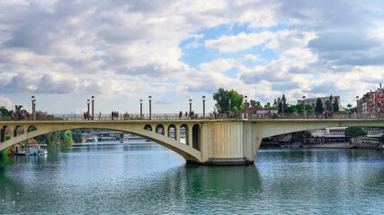 The San Telmo Bridge spans the Guadalquivir River, Seville, Spain