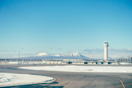 A view of the runway and control tower of New Chitose Airport