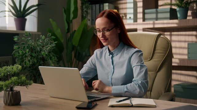 Satisfied Caucasian woman business employer businesswoman typing accomplish done online work computer relax at office desk rest break comfort happy girl achieve finish close laptop stretching hands