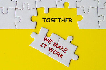 Together We Make It Work text on missing jigsaw puzzle representing teamwork and unity. Teamwork...