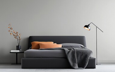 Modern bedroom interior design with a gray upholstered bed, burnt orange pillows, and a black floor lamp against a light gray wall.  Neutral color palette creates a calm atmosphere