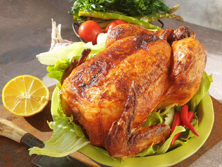 Succulent Roasted Chicken Served on Fresh Greens With Lemon and Vegetables for a Delightful Meal