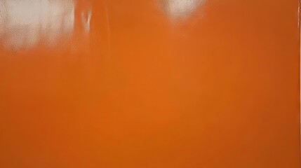 Solid orange surface, smooth texture, background. Possible use for wallpaper or material samples