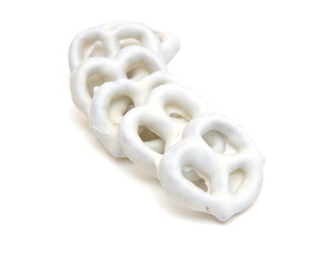 White chocolate covered pretzels on white background 