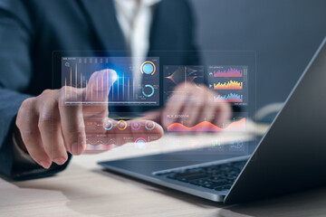 man or data analyst works with a computer on virtual screen for analyzing business data using statistical graphs, managing data structure on dashboard, evaluating and measuring business performance