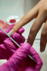 Nails manicure with file. Woman beautiful nail care. after filling.