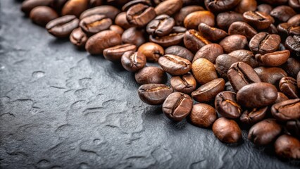 Naklejka premium Aromatic Roasted Coffee Beans Scattered on Dark Textured Surface