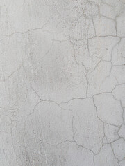 Abstract cracked grey concrete wall texture background