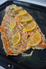 Close up of a grilled whole salmon filet with lemon