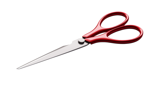 A pair of red handled scissors isolated on a black background
