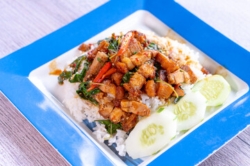 Stir Fried crispy pork with Red Curry and Basil leaves, Thai food