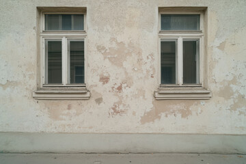Fototapeta premium Two windows on a wall with a white background