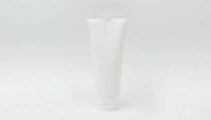 Isolated white plastic tube and bottle cosmetic packaging alongside a blank glass bottle